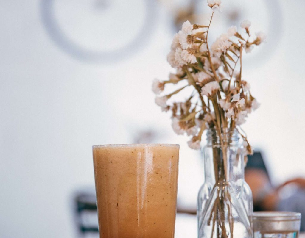 negative-space-healthy-smoothie-on-cafe-table